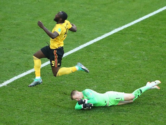Jordan Pickford makes a save from Romelu Lukaku during the World Cup third-place playoff between Belgium and England on July 14, 2018