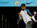 Riyad Mahrez of Leicester City in front of the Manchester City badge during the 2017-18 Premier League season