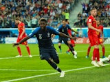 France defender Samuel Umtiti wheels away in celebration after scoring the opening goal of his side's World Cup semi-final with Belgium on July 10, 2018