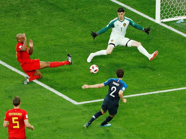 Belgium goalkeeper Thibaut Courtois denies Benjamin Pavard during the World Cup semi-final against France on July 10, 2018