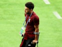 Alex Oxlade-Chamberlain limps off for Liverpool during the Champions League final on May 26, 2018