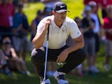 Brooks Koepka lines up a putt on the on the fifth hole during the first round of the Travelers Championship at TPC River Highlands on June 21, 2018 