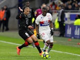 Stade Rennes's Wahbi Khazri in action with Lyon's Tanguy Ndombele on February 11, 2018 
