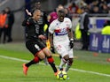 Stade Rennes's Wahbi Khazri in action with Lyon's Tanguy Ndombele on February 11, 2018 