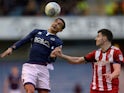 Millwall's Tim Cahill in action with Brentford's John Egan on March 10, 2018 