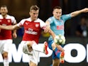 Rob Holding and Kevin Gameiro in action during the pre-season friendly between Arsenal and Atletico Madrid on July 26, 2018
