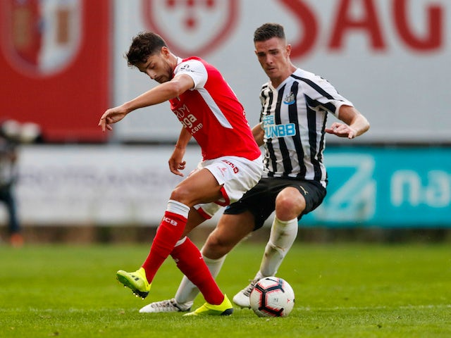 Ciaran Clark and Xadas in action during the pre-season friendly between Braga and Newcastle United on August 1, 2018