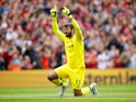Alisson Becker reacts during the Premier League game between Liverpool and West Ham United on August 12, 2018