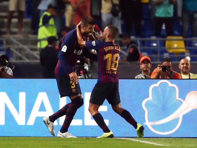 Gerard Pique celebrates his equaliser during the Supercopa de Espana between Sevilla and Barcelona on August 12, 2018