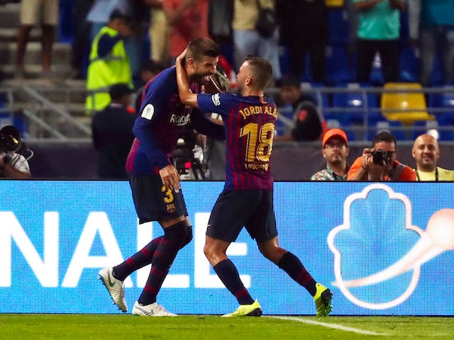 Gerard Pique celebrates his equaliser during the Supercopa de Espana between Sevilla and Barcelona on August 12, 2018