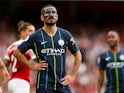 Ilkay Gundogan poses with his face mask during the Premier League game between Arsenal and Manchester City on August 12, 2018