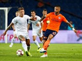 Jeff Hendrick and Manuel da Costa in action during the Europa League quarter-final game between Istanbul Basaksehir and Burnley on August 9, 2018