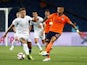 Jeff Hendrick and Manuel da Costa in action during the Europa League quarter-final game between Istanbul Basaksehir and Burnley on August 9, 2018