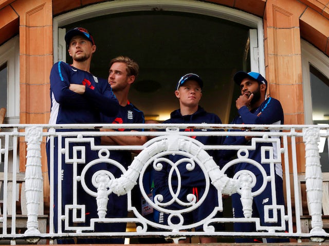 Joe Root, Stuart Broad, Adil Rashid and Ollie Pope observe as rain washes out the first day of the second Test between England and India at Lord's on August 9, 2018