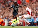 Mesut Ozil and Raheem Sterling in action during the Premier League game between Arsenal and Manchester City on August 12, 2018