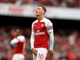 Mesut Ozil cops a feel during the Premier League game between Arsenal and Manchester City on August 12, 2018