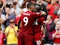 Sadio Mane celebrates with Roberto Firmino after scoring during the Premier League game between Liverpool and West Ham United on August 12, 2018