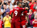 Sadio Mane celebrates with Roberto Firmino after scoring during the Premier League game between Liverpool and West Ham United on August 12, 2018