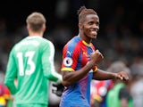 Crystal Palace winger Wilfried Zaha celebrates after scoring during his side's Premier League clash with Fulham on August 11, 2018