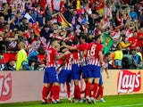 Atletico Madrid striker Diego Costa celebrates with teammates after opening the scoring in the UEFA Super Cup match against Real Madrid on August 15, 2018