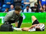 Newcastle United's Javier Manquillo receives treatment from medical staff after sustaining an injury during the match against Cardiff City on August 18, 2018