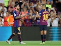 Lionel Messi celebrates with Jordi Alba after scoring Barcelona's opening goal against Alaves on August 18, 2018