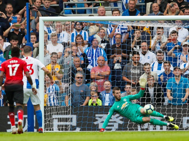 Brighton & Hove Albion's Pascal Gross converts from the penalty spot against Manchester United's David de Gea on August 19, 2018