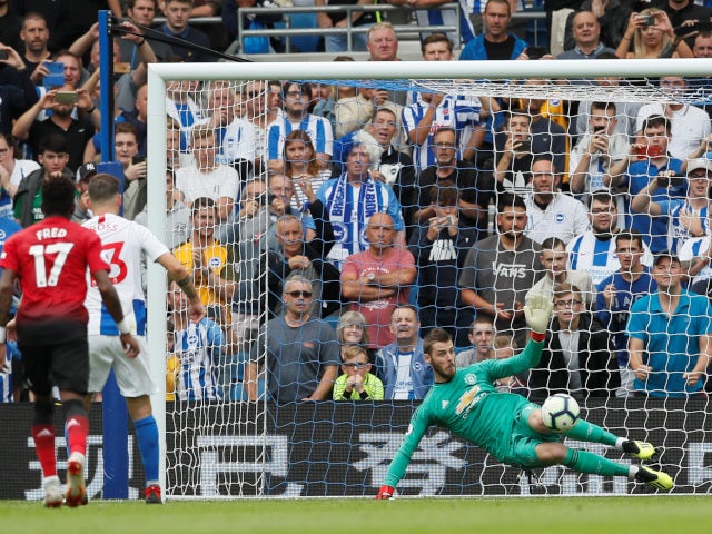 Brighton & Hove Albion's Pascal Gross converts from the penalty spot against Manchester United's David de Gea on August 19, 2018