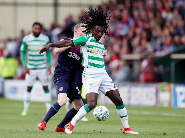 Sessi D'Almeida envelops Jake Doyle-Hayes during the EFL Cup first-round game between Yeovil Town and Aston Villa on August 14, 2018