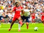 Fulham's Timothy Fosu-Mensah challenges Tottenham Hotspur's Harry Kane on August 18, 2018