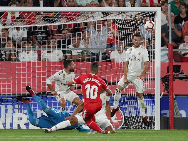 Girona forward Borja Garcia scores the opening goal of his side's La Liga clash with Real Madrid on August 26, 2018