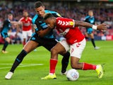 Middlesbrough's Britt Assombalonga in action with West Bromwich Albion's Jake Livermore on August 24, 2018