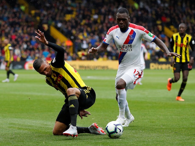 Christian Benteke and Jose Holebas in action during the Premier League game between Watford and Crystal Palace on August 26, 2018