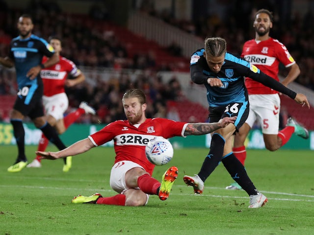 Middlesbrough midfielder Adam Clayton blocks an effort from West Bromwich Albion striker Dwight Gayle during their Championship clash on August 24, 2018
