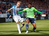 Huddersfield Town's Florent Hadergjonaj in action with Cardiff City's Josh Murphy during their Premier League clash on August 25, 2018