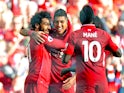 Liverpool striker Mohamed Salah celebrates with Roberto Firmino and Sadio Mane after opening the scoring during his side's Premier League clash with Brighton & Hove Albion on August 25, 2018