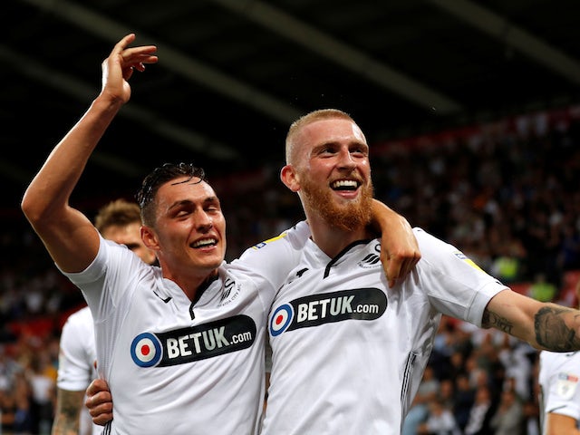Ollie McBurnie celebrates scoring for Swansea City against Leeds United on August 21, 2018