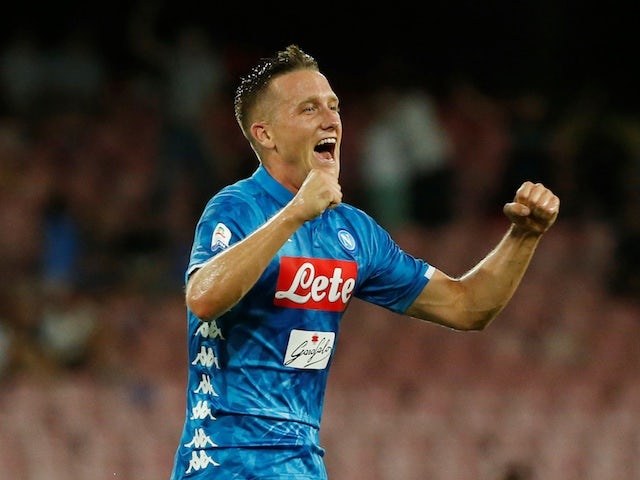 Napoli's Piotr Zielinski celebrates scoring against AC Milan during their Serie A clash on August 25, 2018