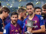 Barcelona midfielder Sergio Busquets with Lionel Messi after his side's Spanish Super Cup win in August 2018