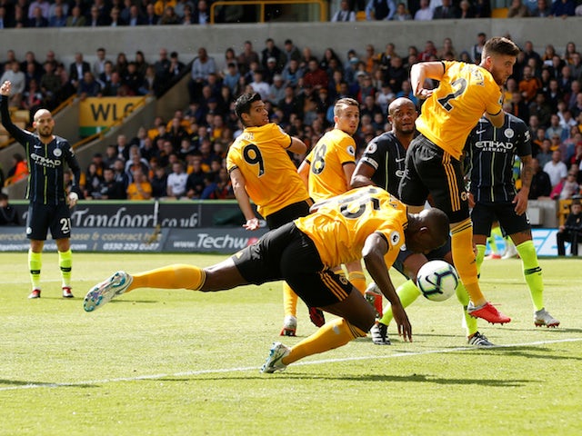 Wolverhampton Wanderers defender Willy Boly scores with his arm during their Premier League clash with Manchester City on August 25, 2018