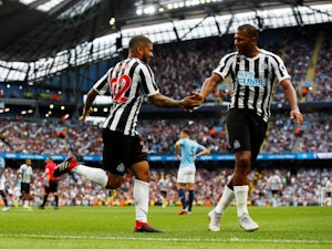 DeAndre Yedlin celebrates with Newcastle United teammate Salomon Rondon after equalising against Manchester City on September 1, 2018
