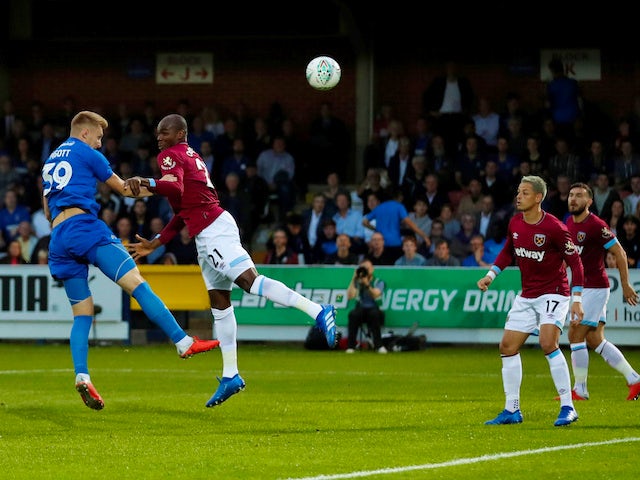 Joe Pigott scores the opener during the EFL Cup second-round game between AFC Wimbledon and West Ham United on August 28, 2018