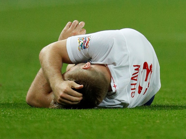 England's Luke Shaw lies on the pitch after sustaining an injury during the UEFA Nations League match against Spain on September 8, 2018