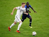 Germany's Marco Reus in action with France's N'Golo Kante on September 6, 2018