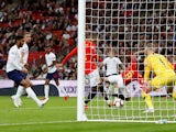 Spain's Rodrigo scores their second goal past England's Jordan Pickford during the UEFA Nations League match on September 8