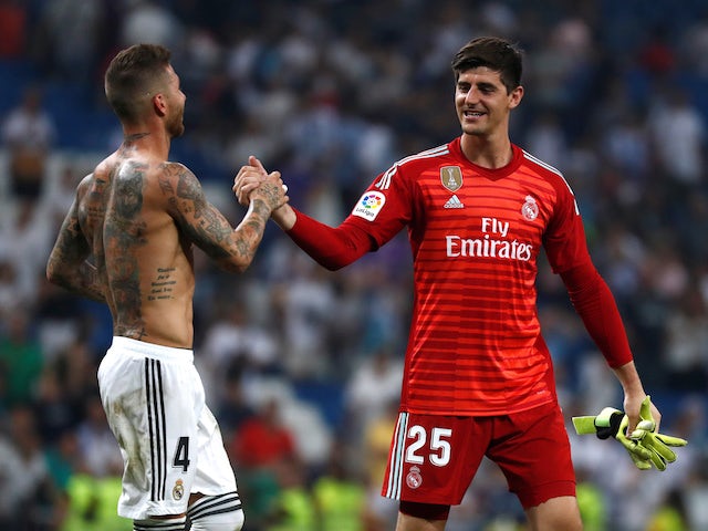 Real Madrid's Thibaut Courtois and Sergio Ramos shake hands on September 1, 2018