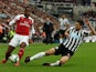 Alexandre Lacazette and Federico Fernandez in action during the Premier League game between Newcastle United and Arsenal on September 15, 2018