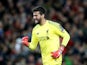 Alisson celebrates the first goal during the Champions League group game between Liverpool and Paris Saint-Germain on September 18, 2018