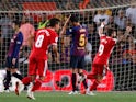 Girona players celebrate after scoring against Barcelona on September 23, 2018