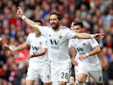 Joao Moutinho celebrates a glorious equaliser during the Premier League game between Manchester United and Wolverhampton Wanderers on September 22, 2018